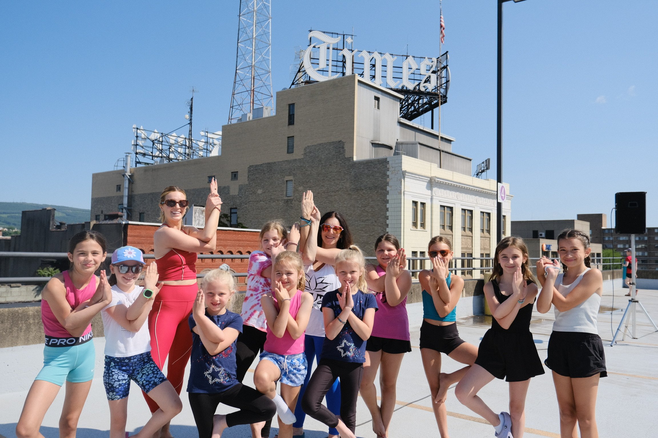 jaya-yoga-studio-kids-eagle-pose-yoga-on-the-roof-scranton-2025.jpg