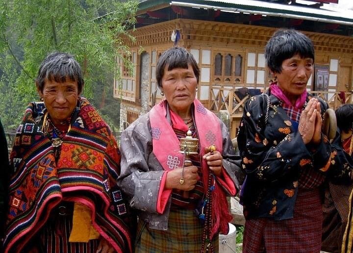 Devout Bhutanese women near Nikka Chu, awaiting the funeral procession for His Eminence Lhalung Thuksey Rinpoche -- one of the three incarnations of the great Bhutanese Terton King Pema Lingpa. He passed away in 2010.

His Eminence was a beloved mast