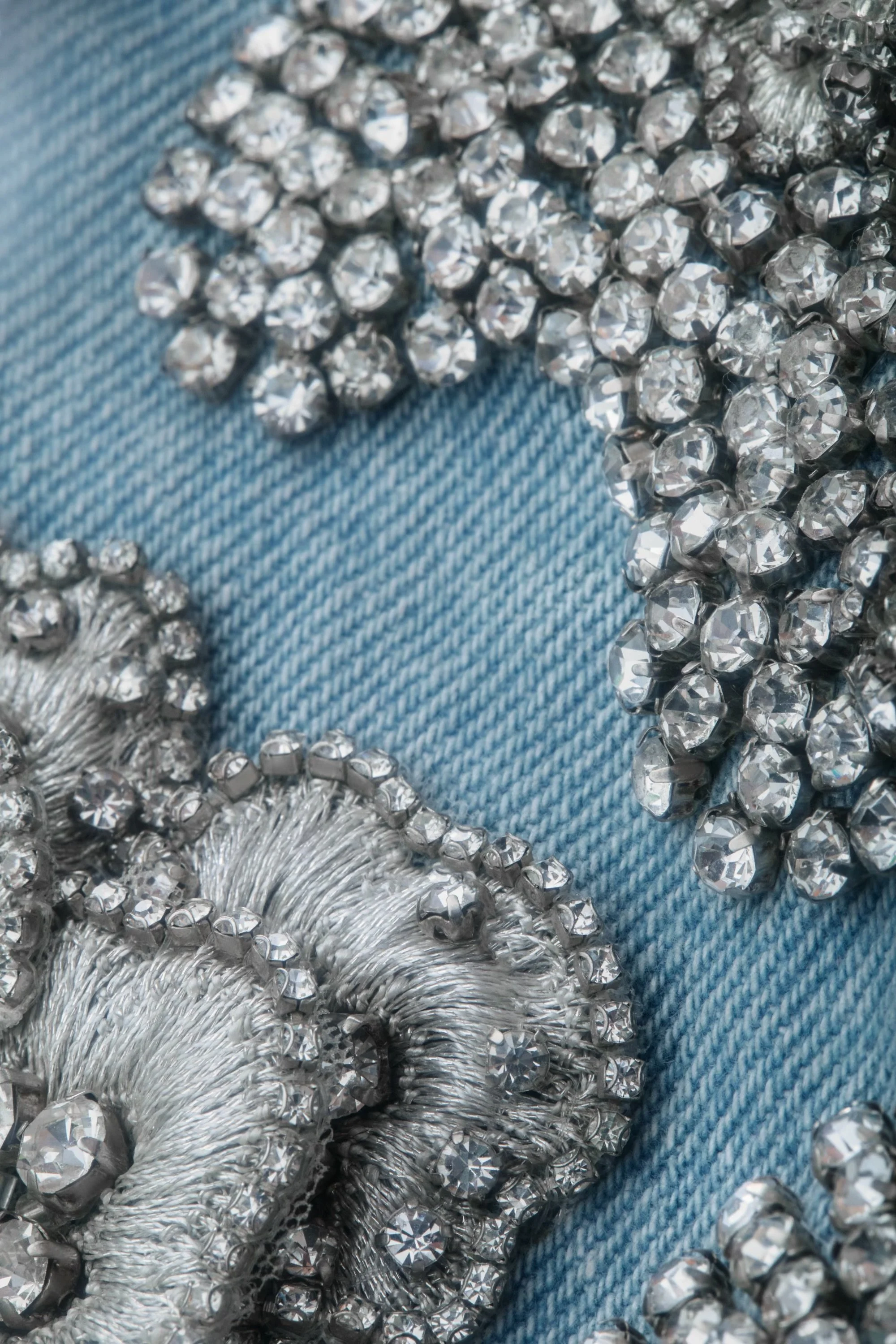 Macro shot of floral beading motifs on the crystalized mini skirt, showing layered structure and craftsmanshi