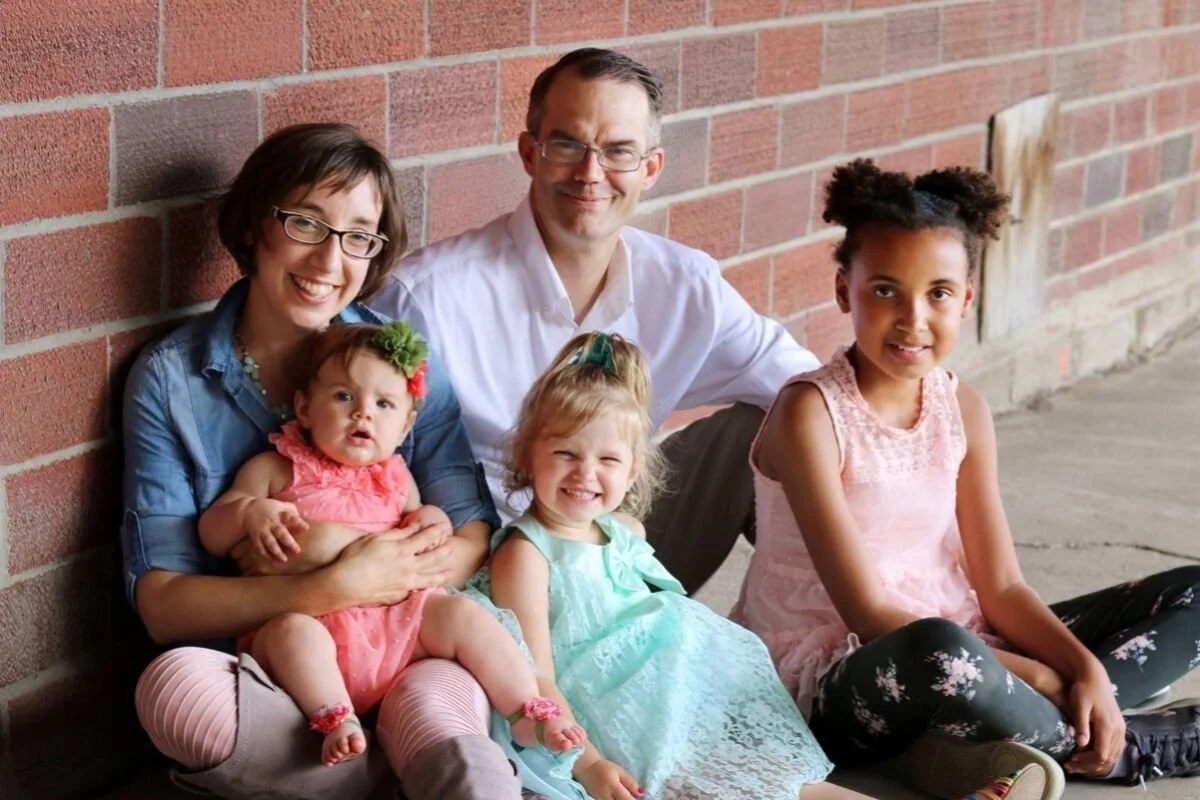 A photo of Nate Lindstrom with his wife and three children