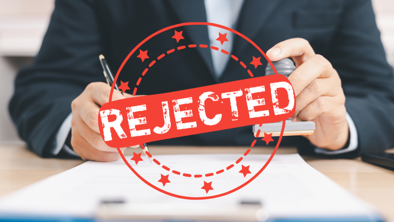 Insurance application stamped "Declined" next to a law enforcement officer training in a martial arts facility