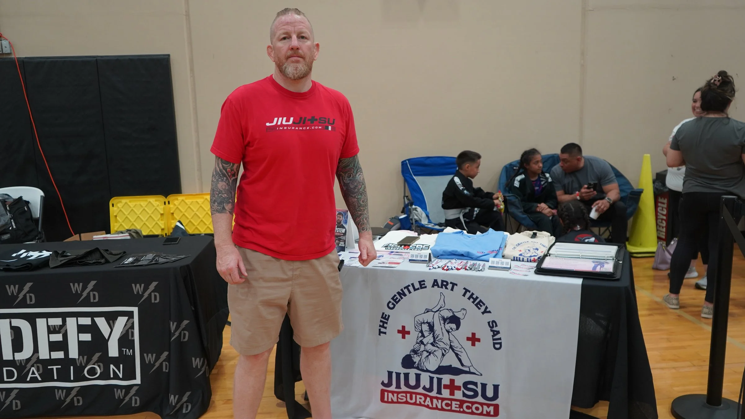 Chris Martin founder of JiuJitsuInsurance.com talking to BJJ athletes about accident medical expense coverage at a Fuji Jiu-Jitsu event