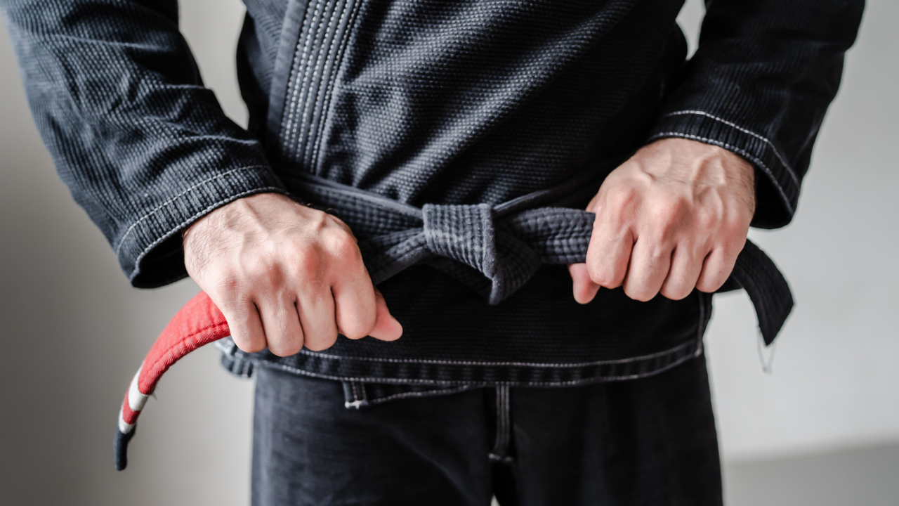 Coach supervising Jiu-jitsu class for safety