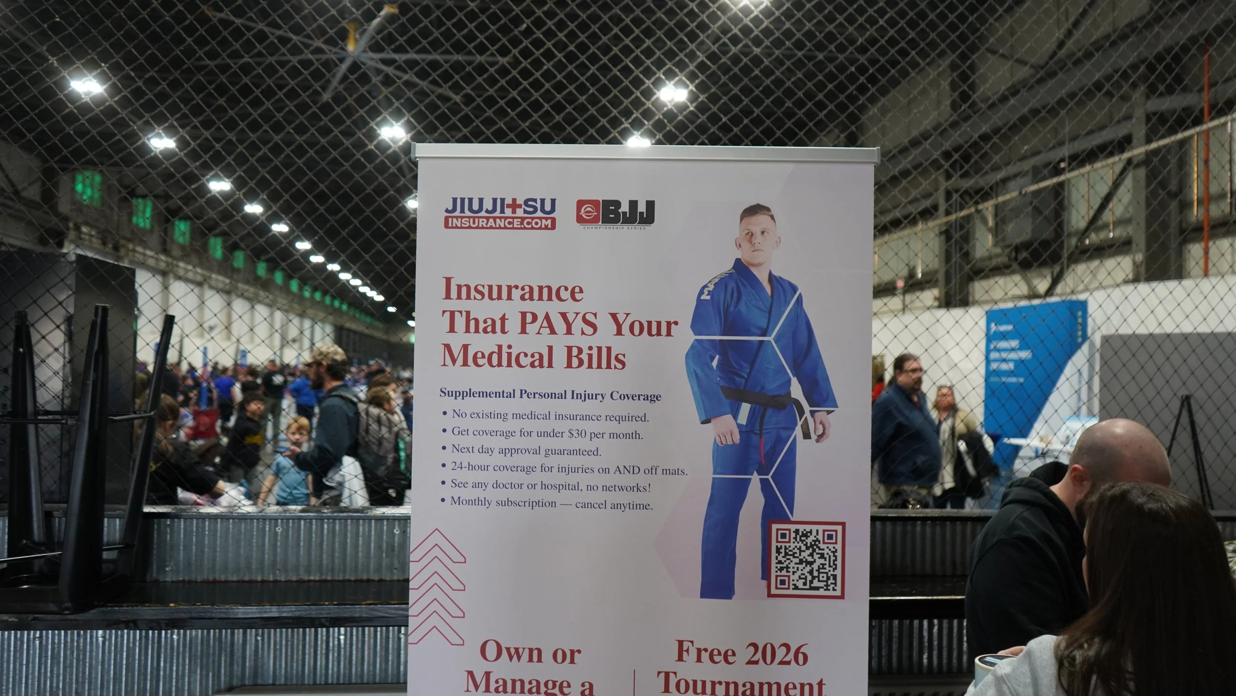Insurance agent at Fuji BJJ event booth in St. Charles