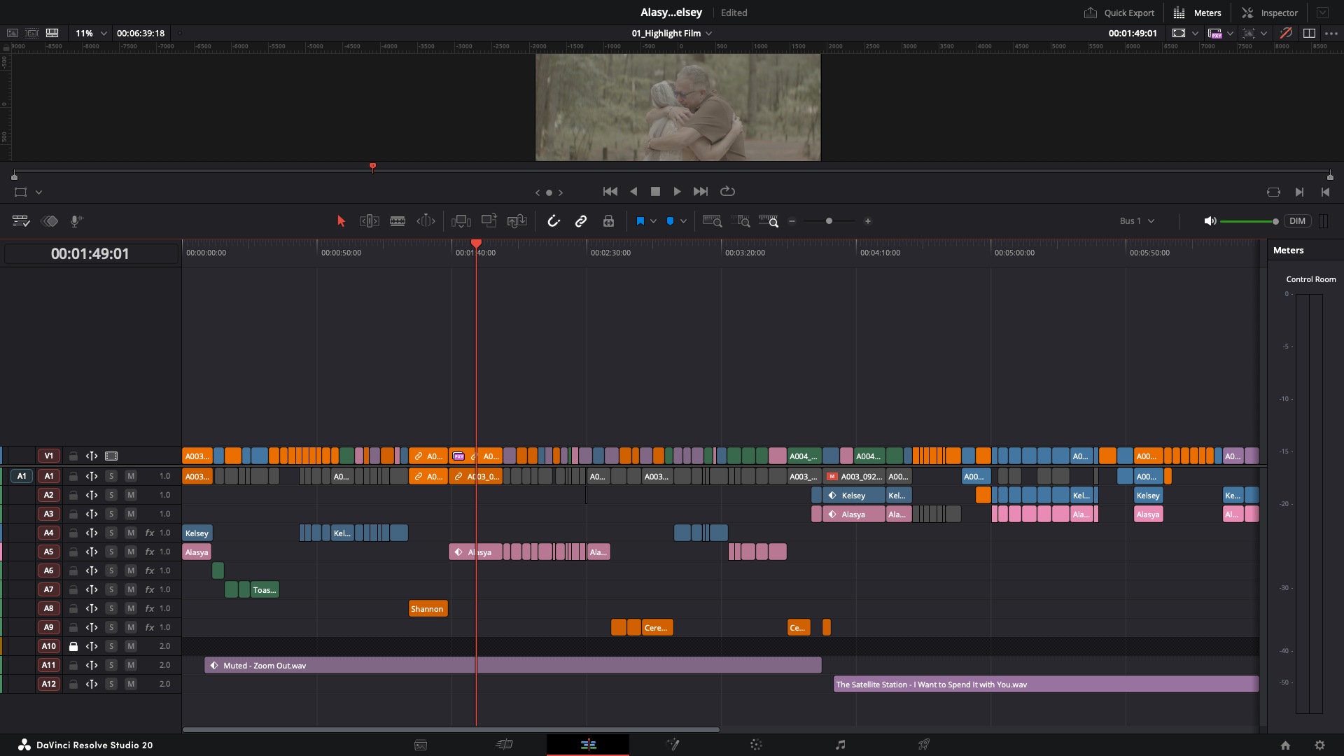 A video editing timeline in DaVinci Resolve Studio 20 showing clips, audio tracks, and editing tools. The clip at the top displays a scene of two people hugging outdoors.