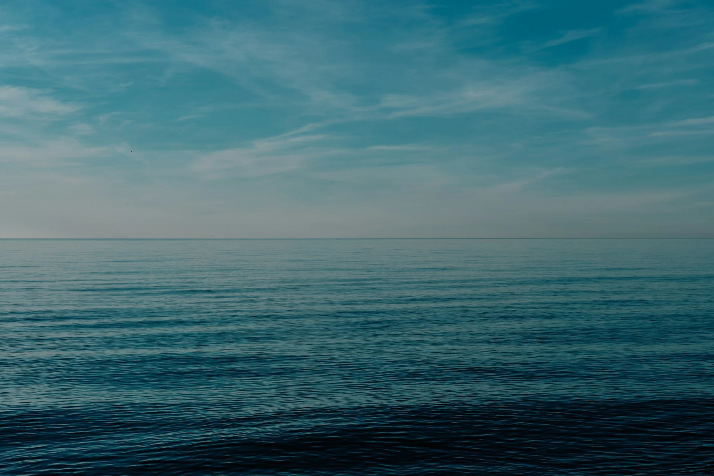 calm horizon over still water representing relaxation and reduced anxiety