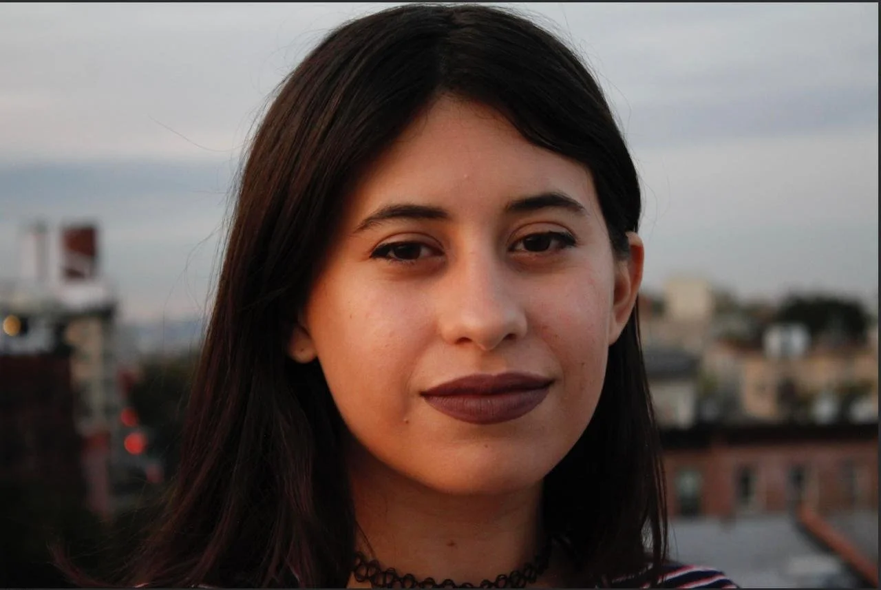 headshot of María Cristina