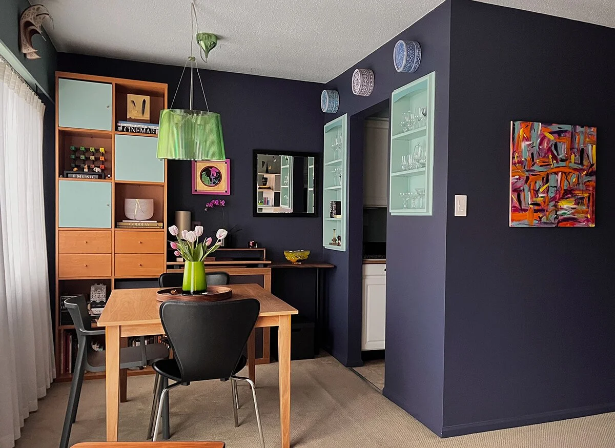 A dining room made both dramatic and cheerful through the use of a curated colour palette

