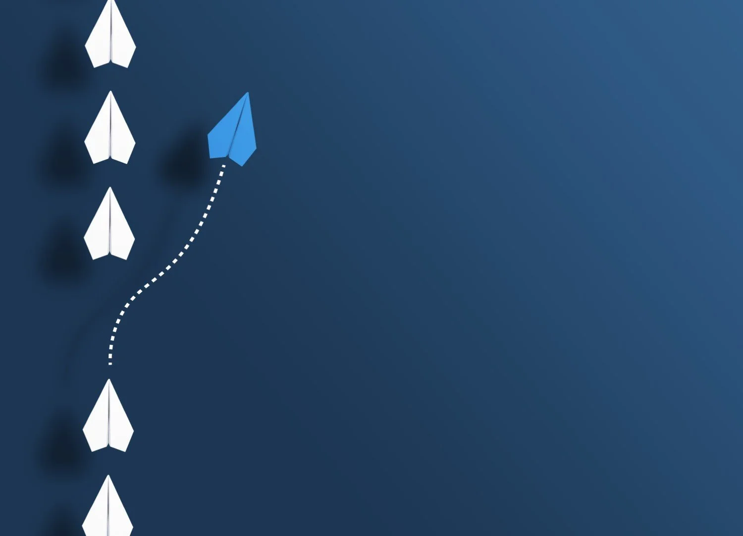 Several white paper airplanes are lined up facing upward on the left side of a blue background. There is a gap and from it a dotted line to a light blue paper airplane flying in a different direction than the others.