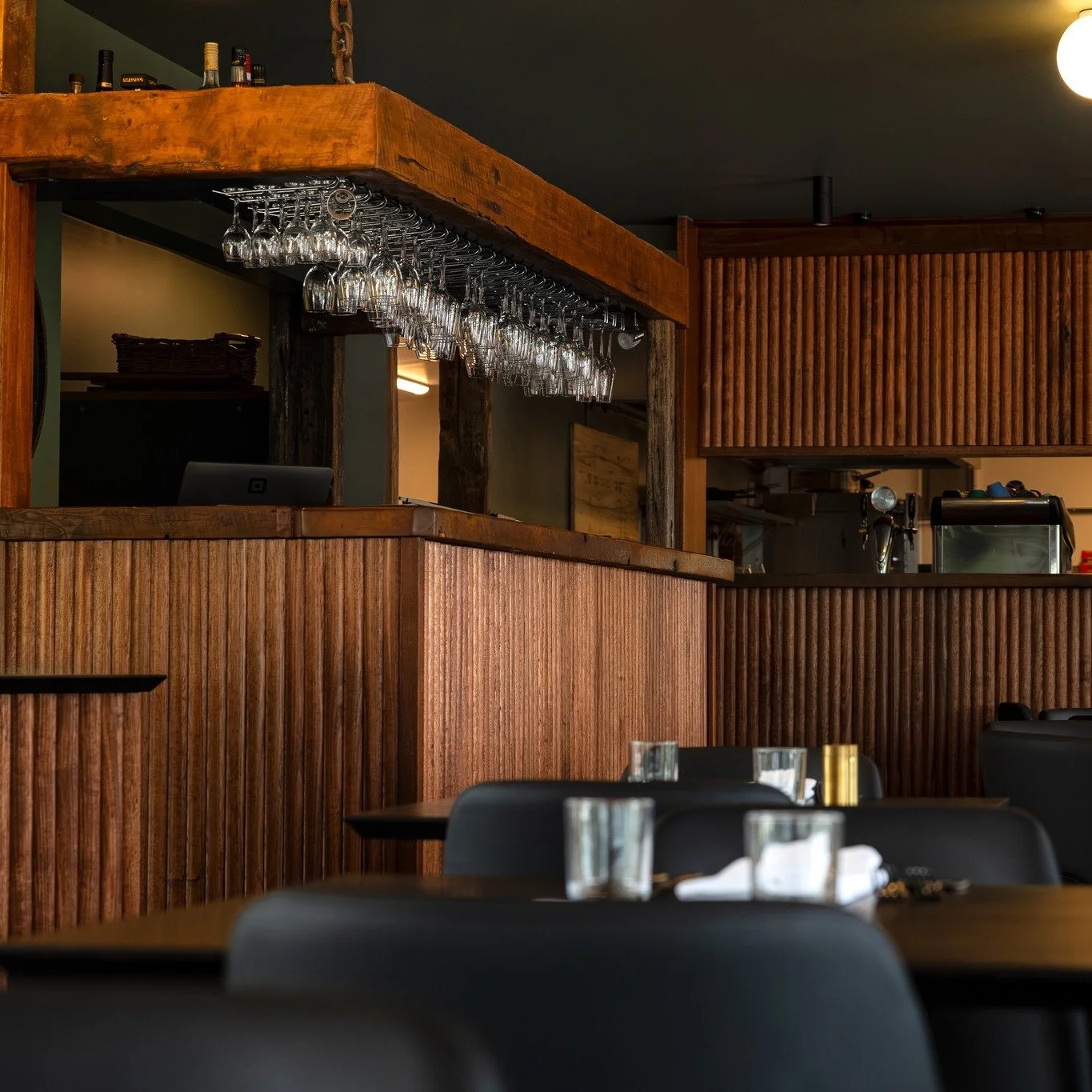 The bar and kitchen pass at Risby's are built from Huon pine salvaged from Strahan's old wharf - timber milled two centuries ago - paired with Tasmanian oak  to bridge past and present.

Huon pine once travelled from the Gordon River through the Risb