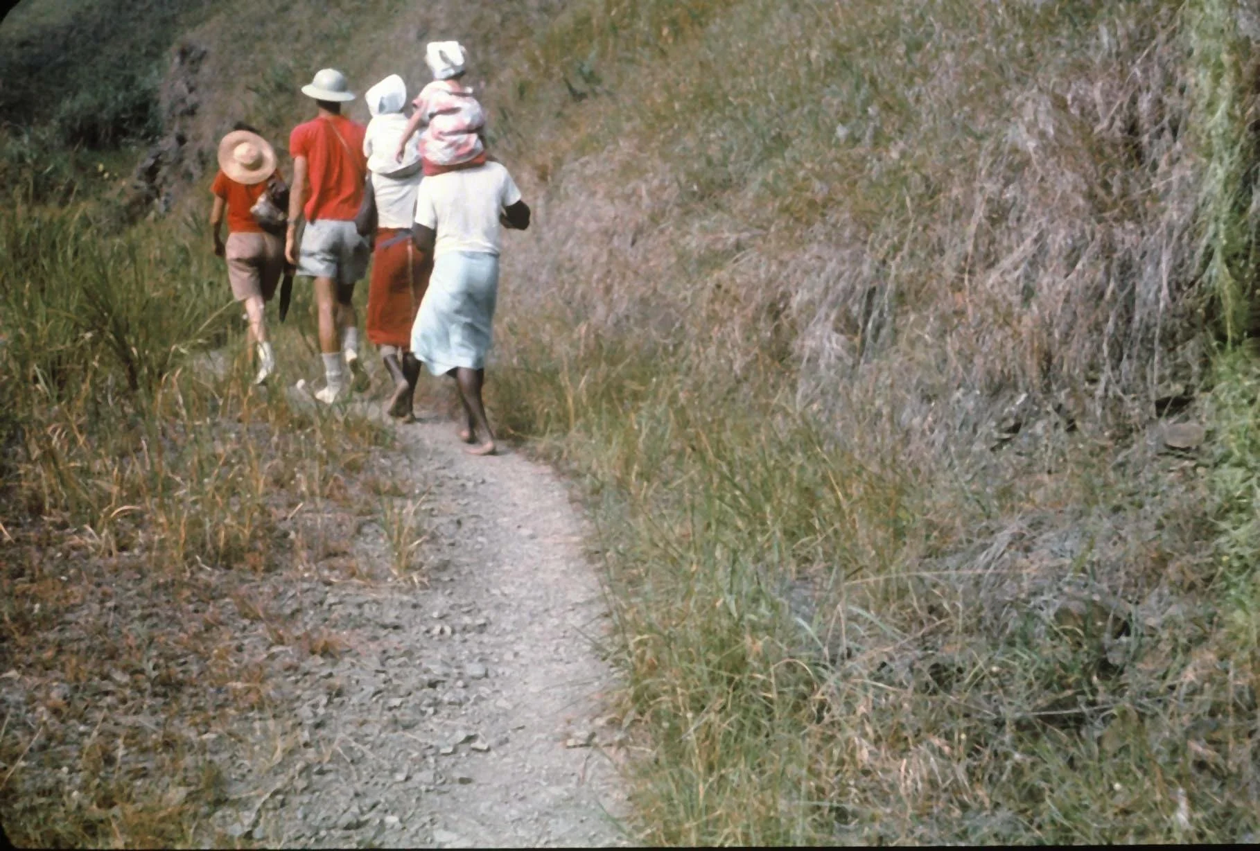 1963 May Buang tripIna in front Paula Tom being carried.jpg