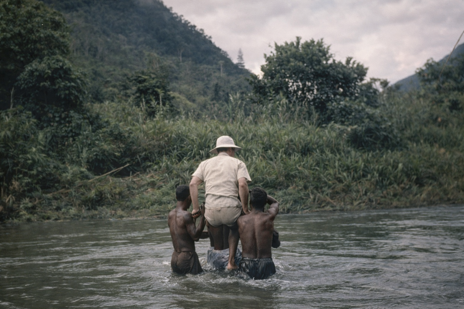 river crossing on shoulders - Copy.jpg