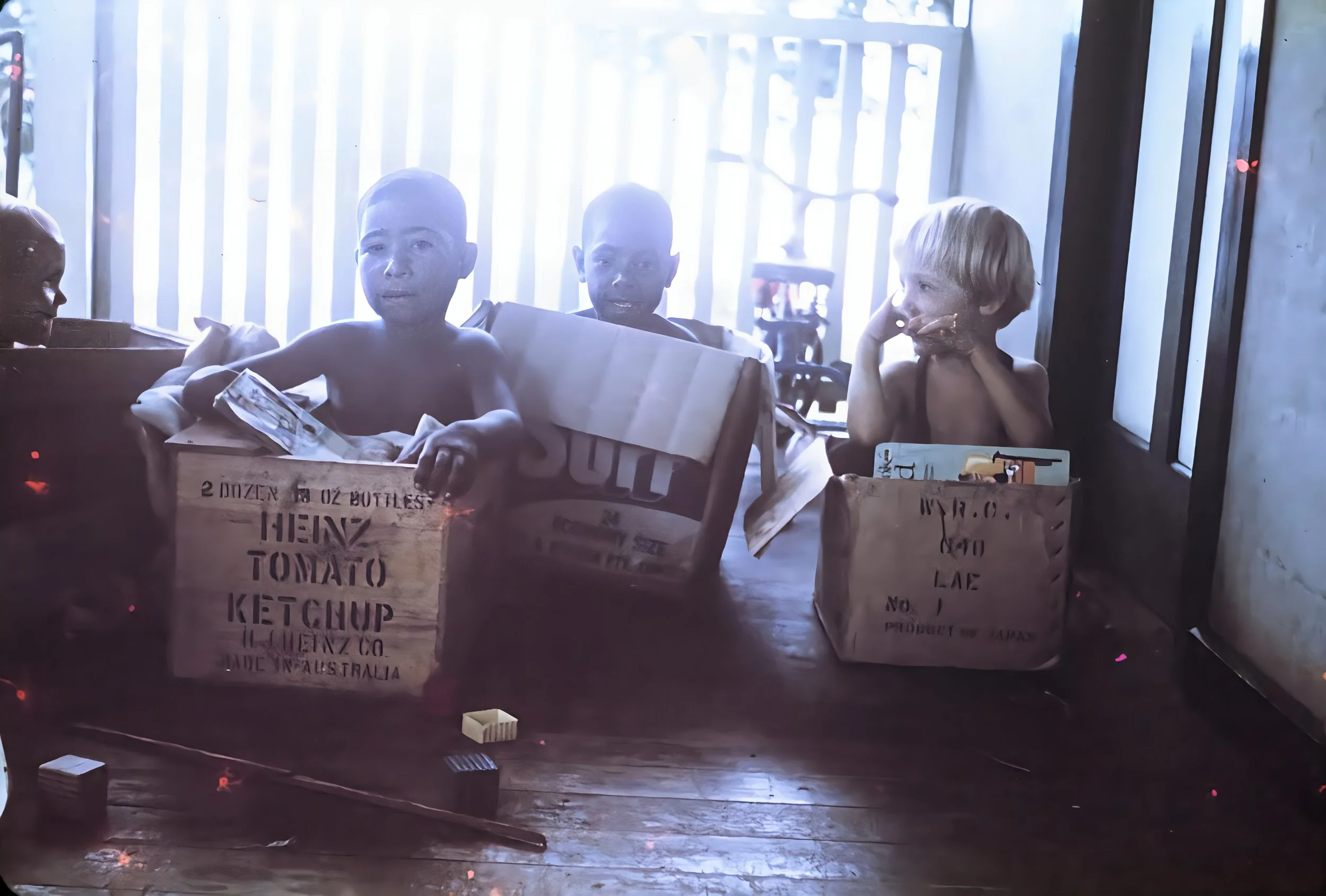 Veranda 1963Paula with sons of personnal living at the Malalo station. Mark the carpenter from Laugwec, Gideon, the teacher..jpg