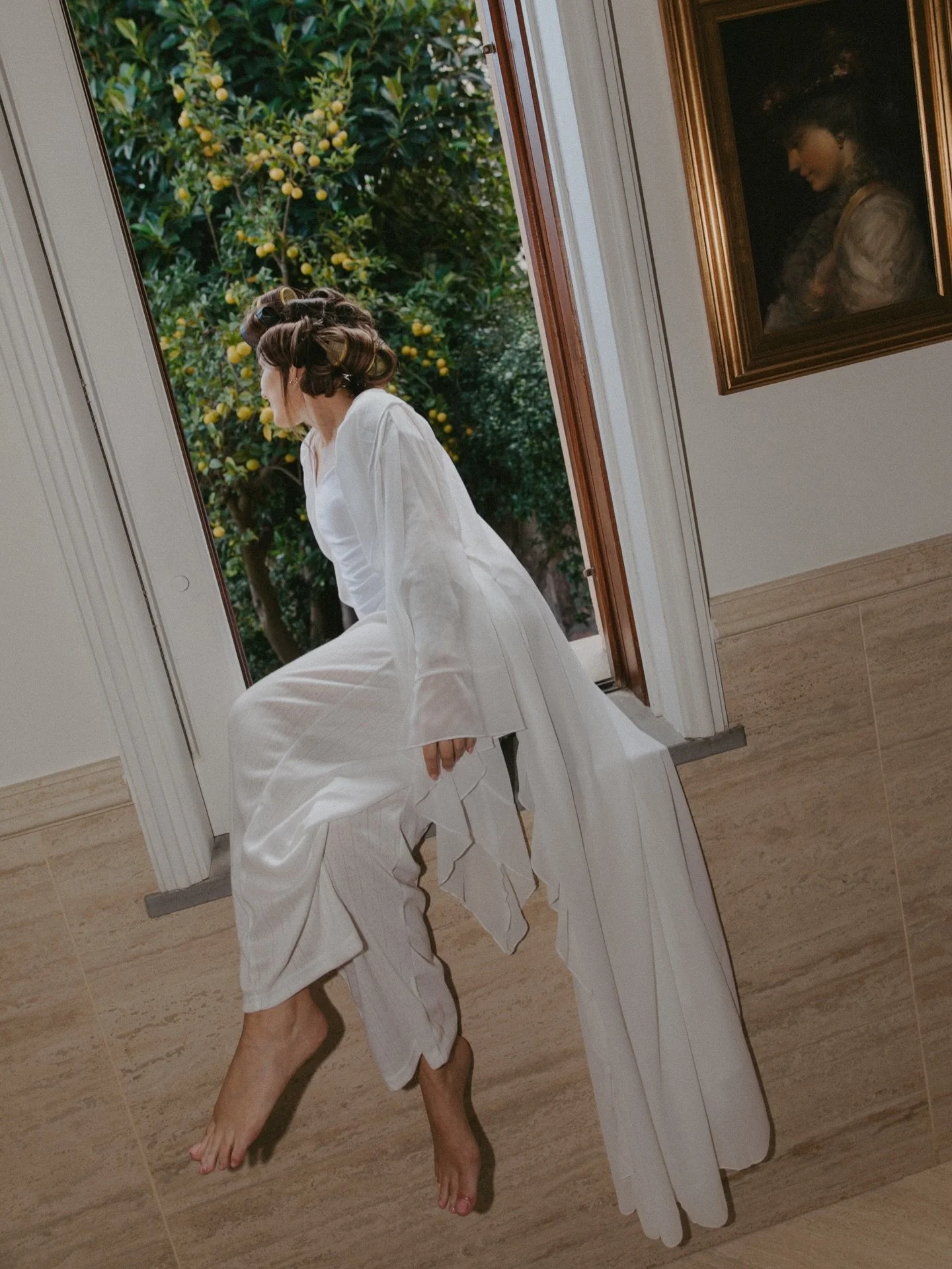 Getting ready with Hunter in the bathroom overlooking their ceremony space. 🍋