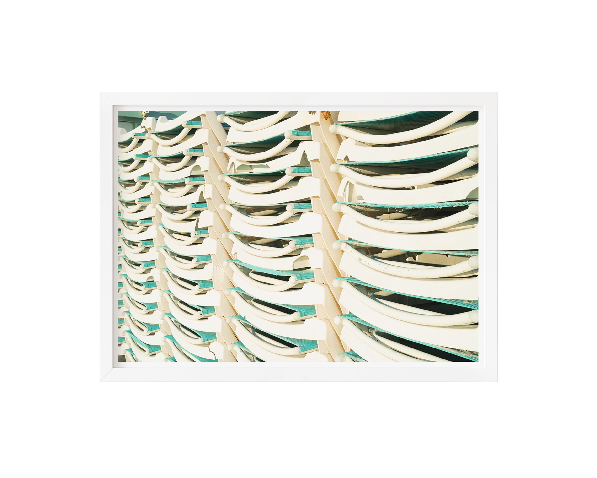 A minimalistic and playful framed fine art print featuring stacked white and teal lounge chairs, bathed in natural sunlight.