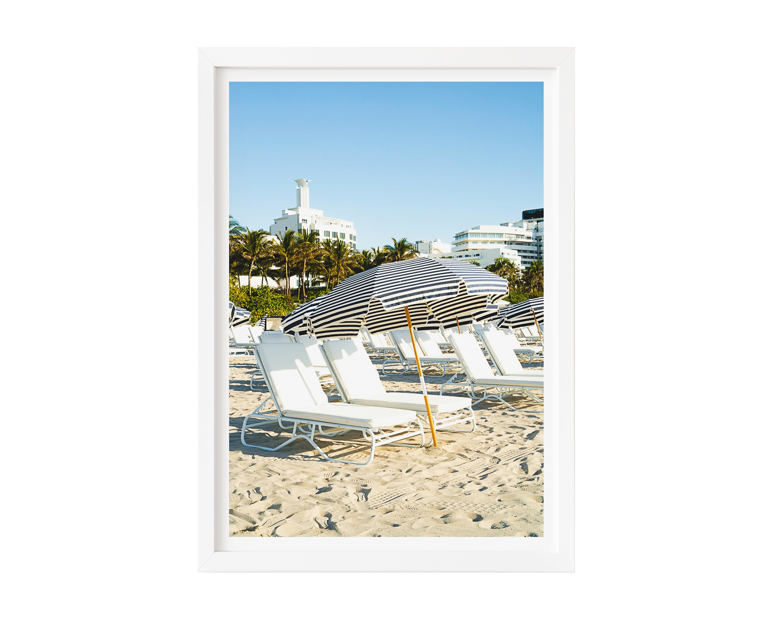 This minimalist beach scene captures architectural repetition and tranquil resort vibes, perfect for modern decor, coastal interiors, or photography collectors seeking serene, geometric compositions.
