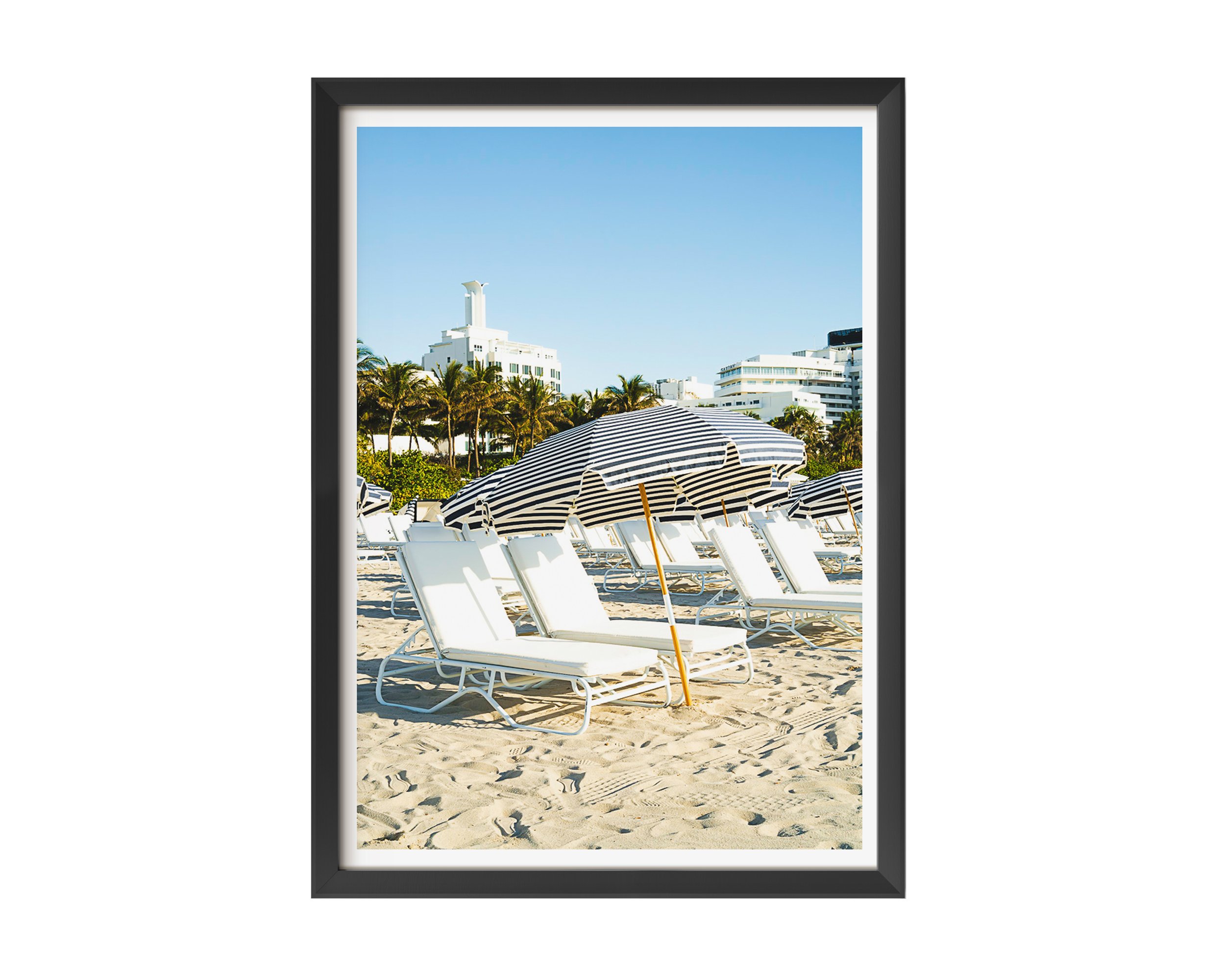 This minimalist beach scene captures architectural repetition and tranquil resort vibes, perfect for modern decor, coastal interiors, or photography collectors seeking serene, geometric compositions.