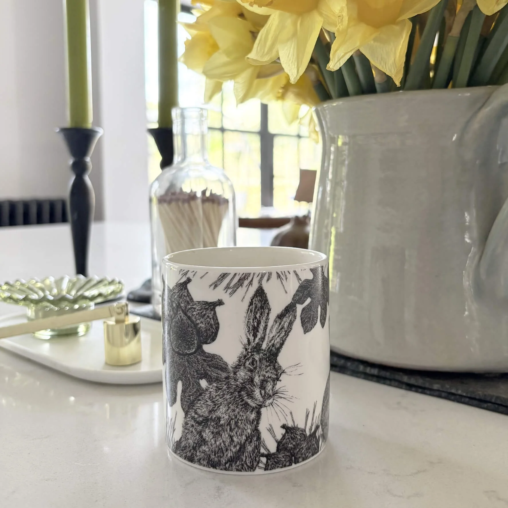 spring_table_daffodill_fig_soy_candle_hares.jpg