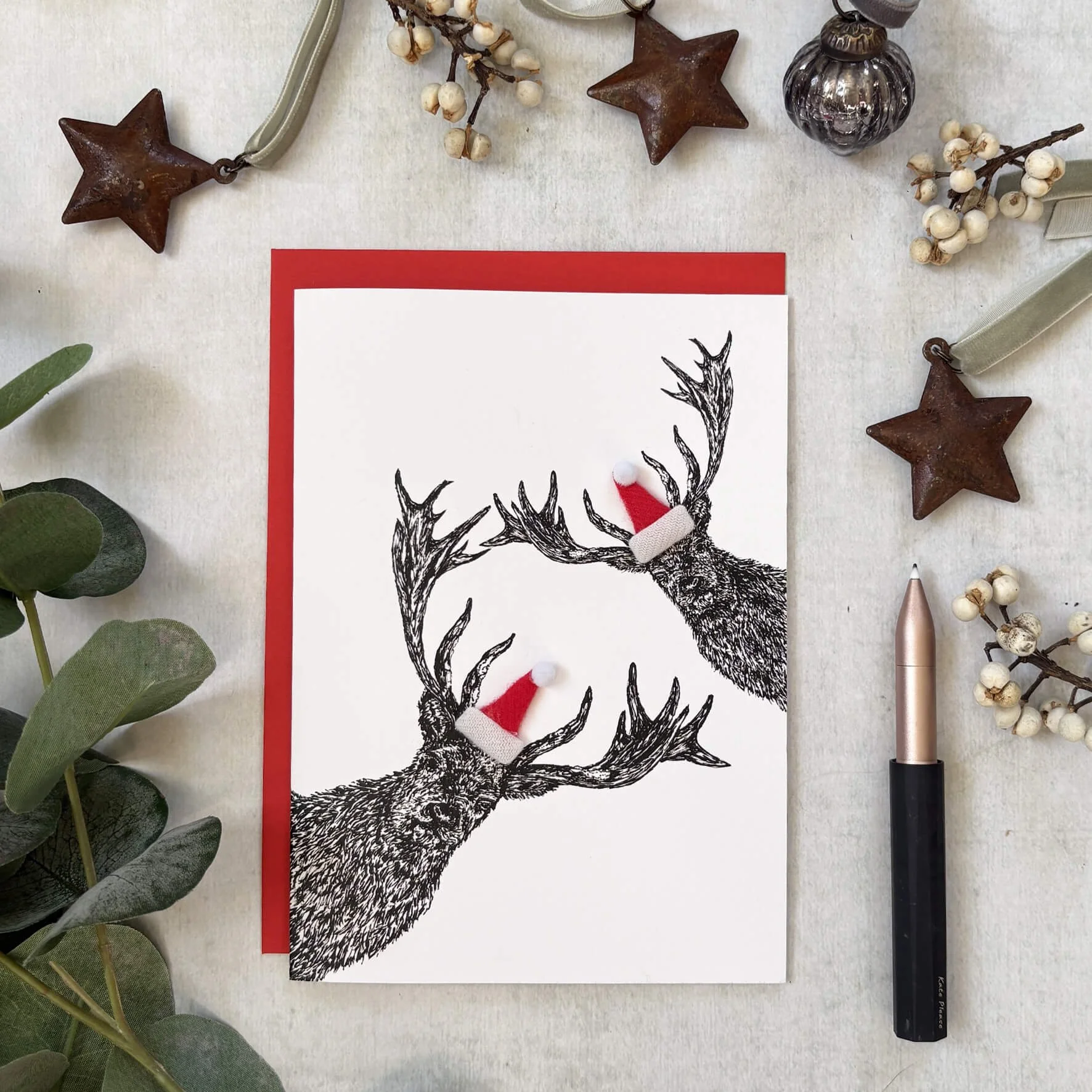Chirstmas_card_peeping_deers_santa_hat.jpg