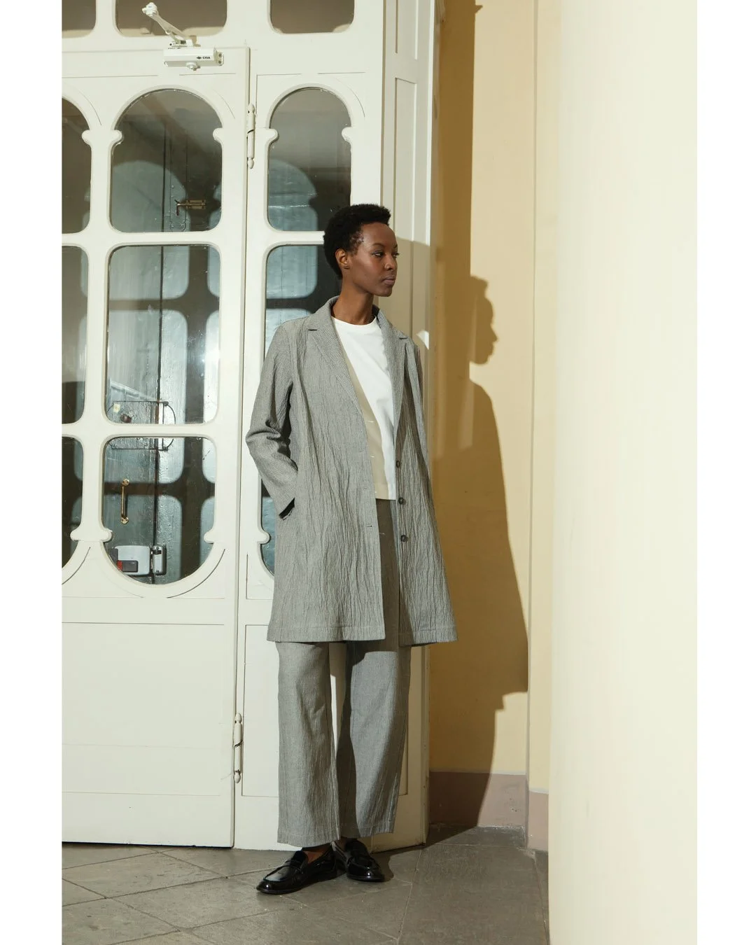 RELAXED CLASSICS. Effortless, never ordinary. This lightweight overcoat pairs a salt-and-pepper cotton blend with a crinkled texture that softens its classic lines and adds character. The perfect balance between polished and laid-back.