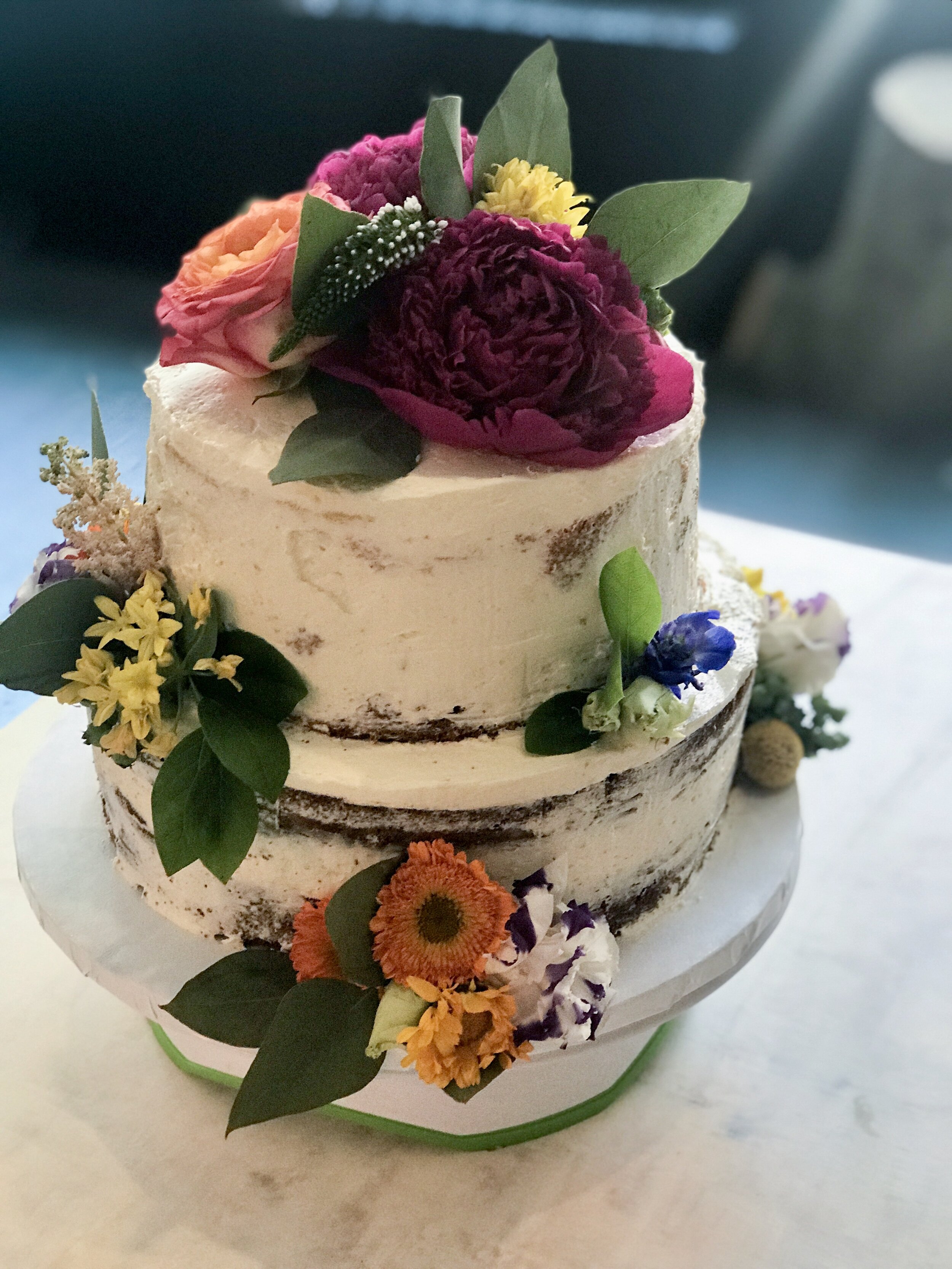 Chocolate Cake with Vanilla Buttercream, Fresh Flowers to match the Bride's Bouquet