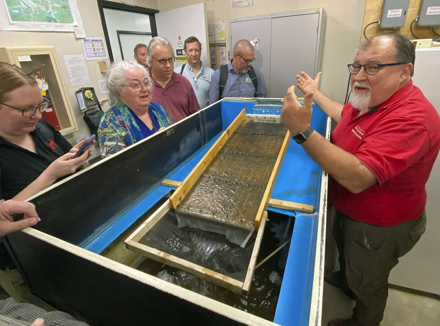 Here's Elmer Gray explaining the rearing setup.  The larvae of black flies develop in fast moving water, which they recreate indoors with these ingenious water pump setups.  When the adult flies are ready to start emerging the whole tank is covered w