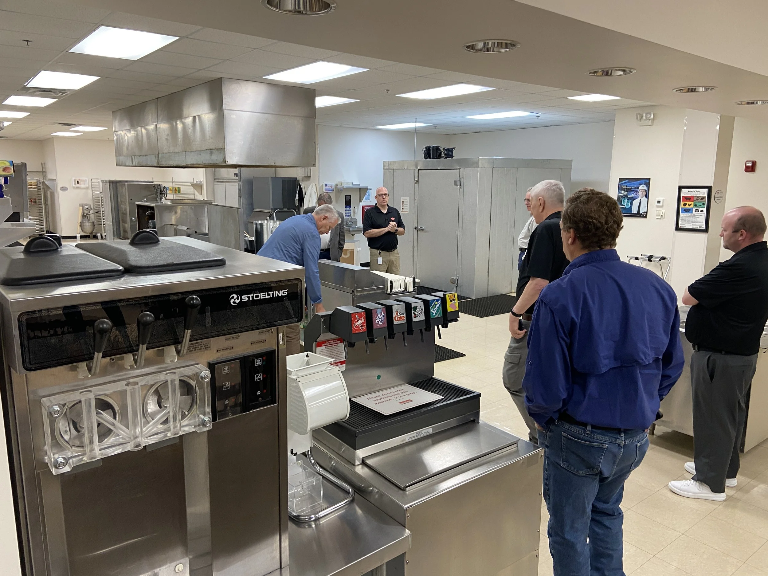 The next day we visited the Rollins Training Center and Museum.  Very impressive.  They have just about any urban environment imaginable to train pest management in.  Here, Glen shows off a commercial kitchen reproduction.