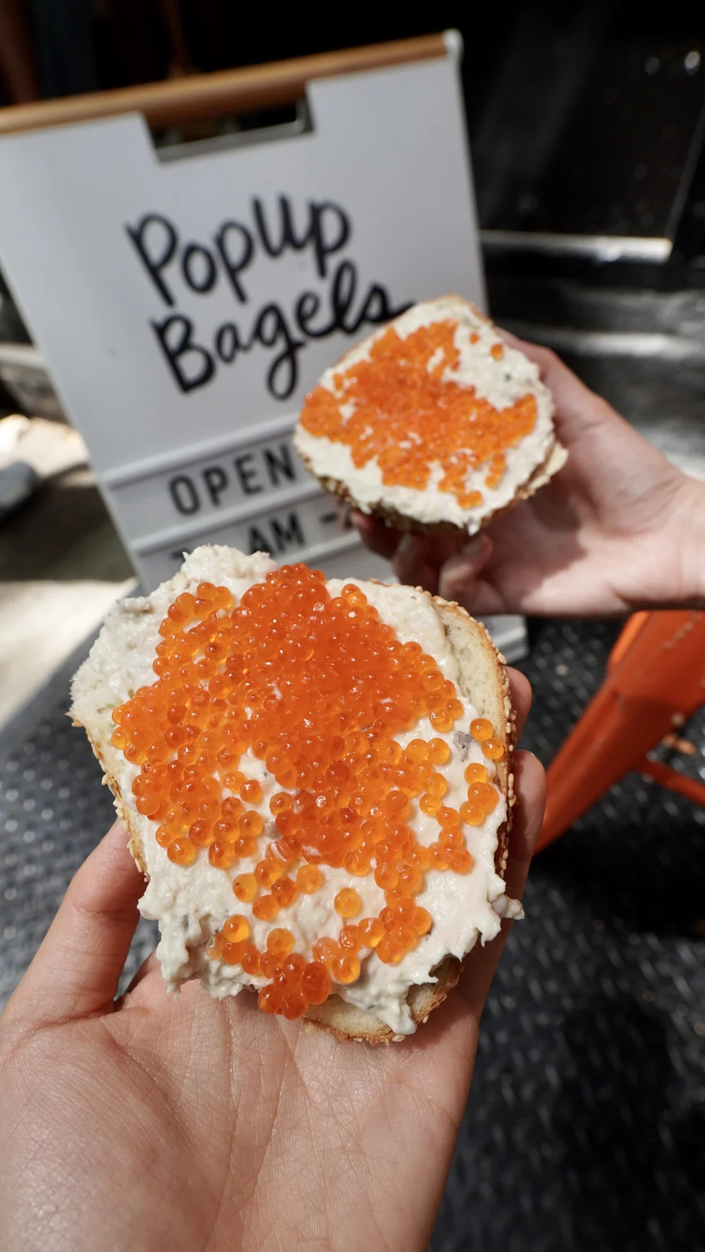 Sesame bagel with whitefish salad and trout roe from Popup Bagels
