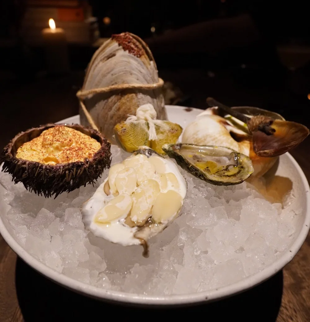 Selection of raw bar from their “snack cart” - get the uni and the pineapple oyster from Ilis