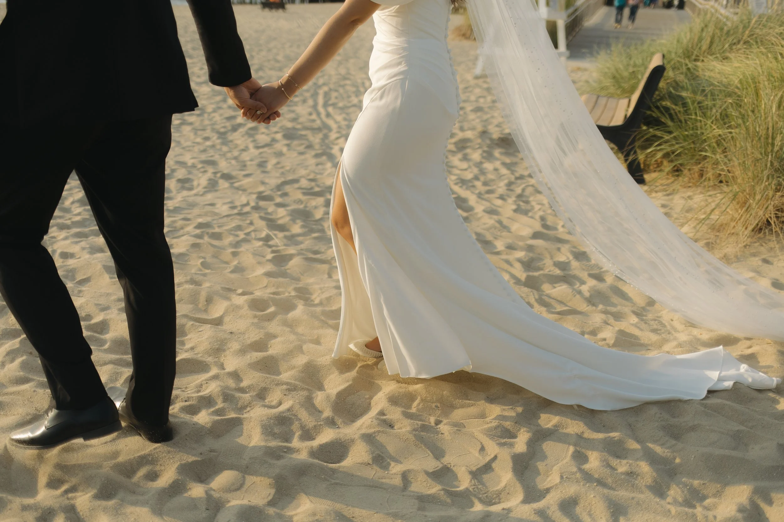 Portraits of bride and groom walking holding hands, beach photos, travel destination photographer