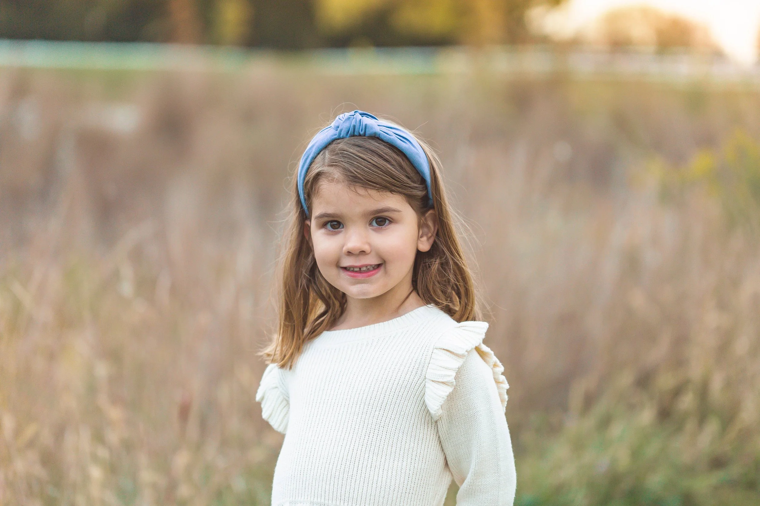 A photo of a child at a mini family photo shoot in Hinsdale, IL. Photographed by Heidi Aubin, family portrait photographer. 