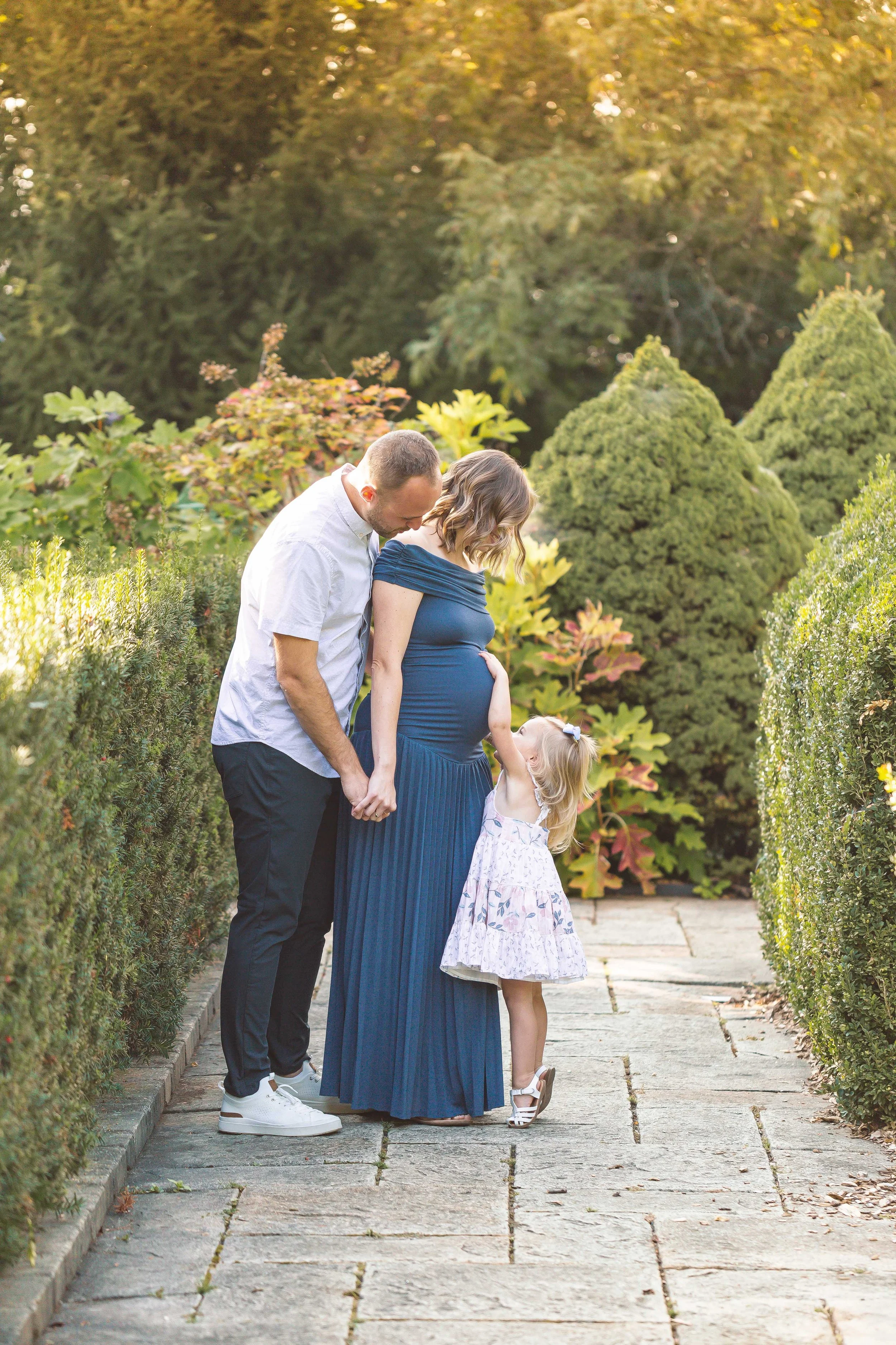 Photo of expecting mom at a maternity photo shoot with Heidi Aubin, maternity photographer at Hurley Gardens in Wheaton, IL.