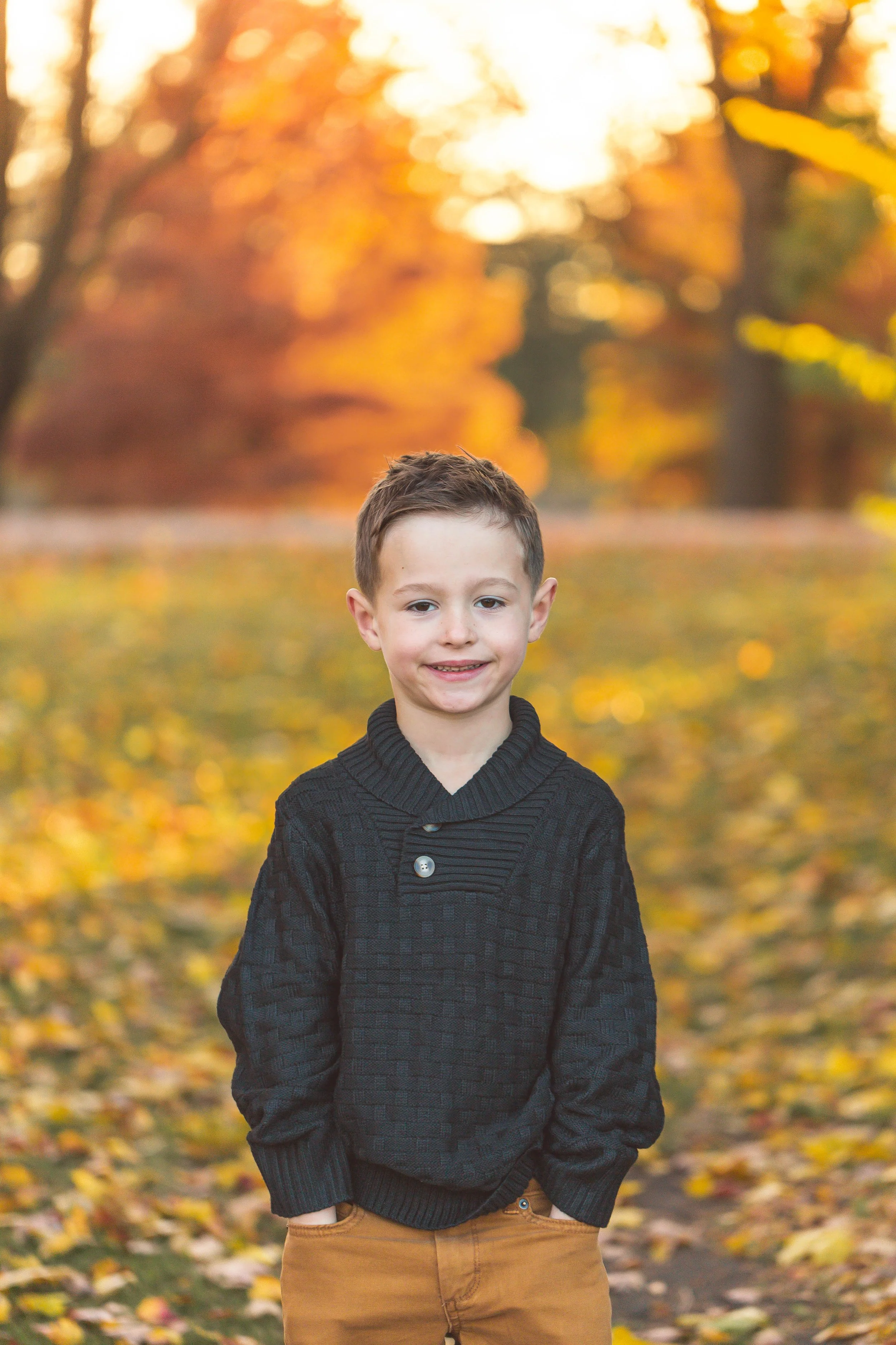 A photo of a child at a family photo shoot in Glen Ellyn, IL. Photographed by Heidi Aubin, family portrait photographer. 