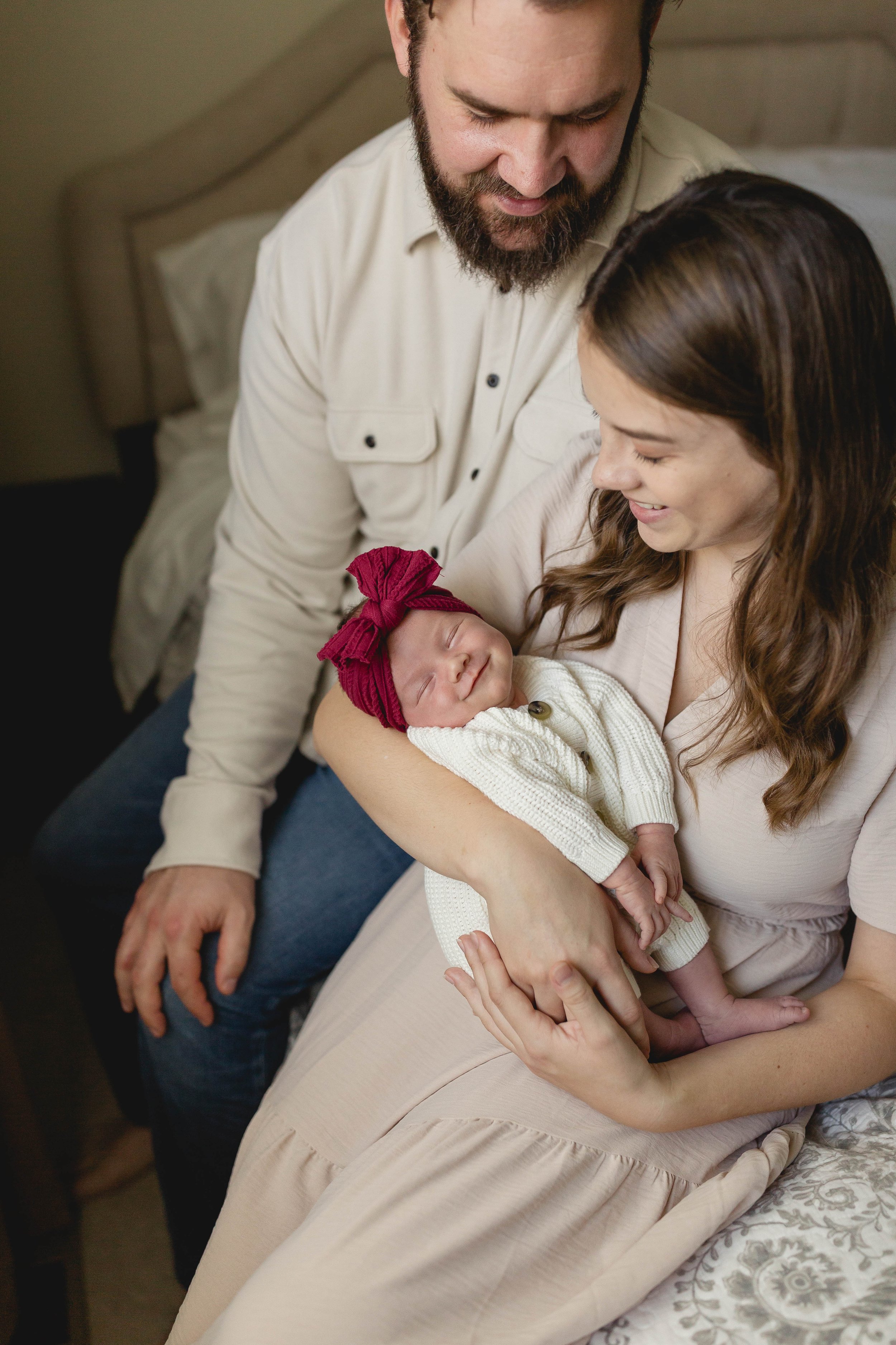 Photo of a newborn smiling at a lifestyle newborn session in Wheaton, IL.