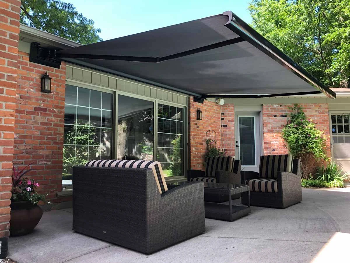Retractable patio awning extended over a residential deck in London, Ontario