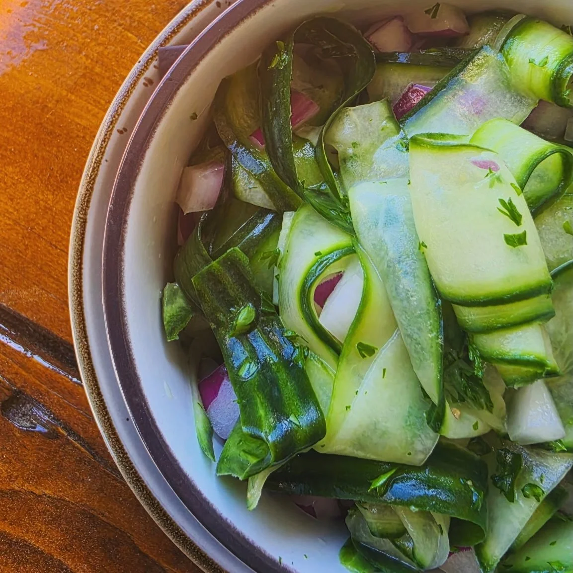 ☀️🥒 TEST KITCHEN MVP TODAY? No contest.

The Cucumber Salad absolutely came through clutch on a hot day like today. 😎

Cool, crisp, refreshing, and packed with fresh flavor. Thin shaved cucumbers, red onion, parsley, and our lemon garlic dressing m