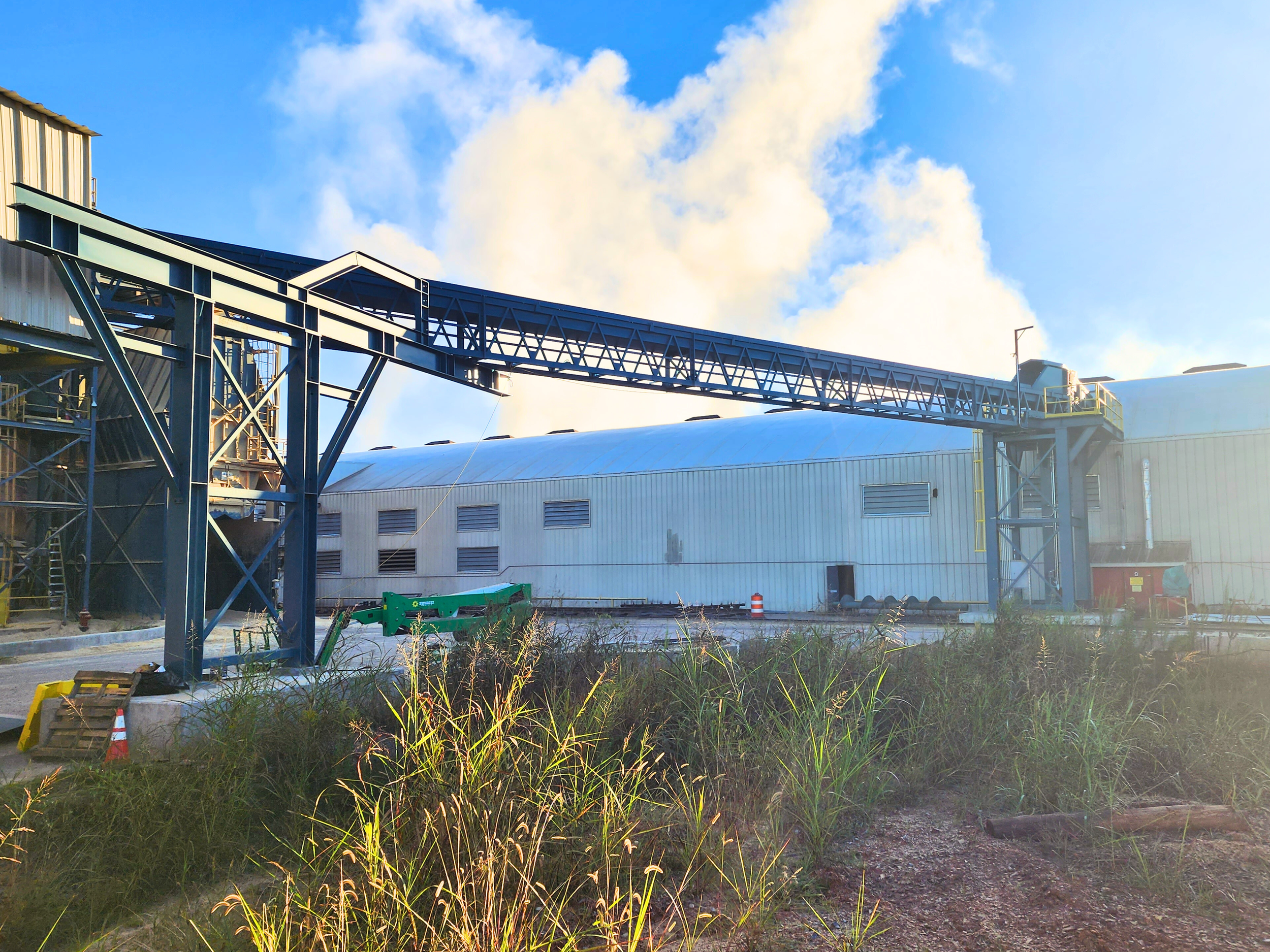 Conveyor going into bldg outside.png