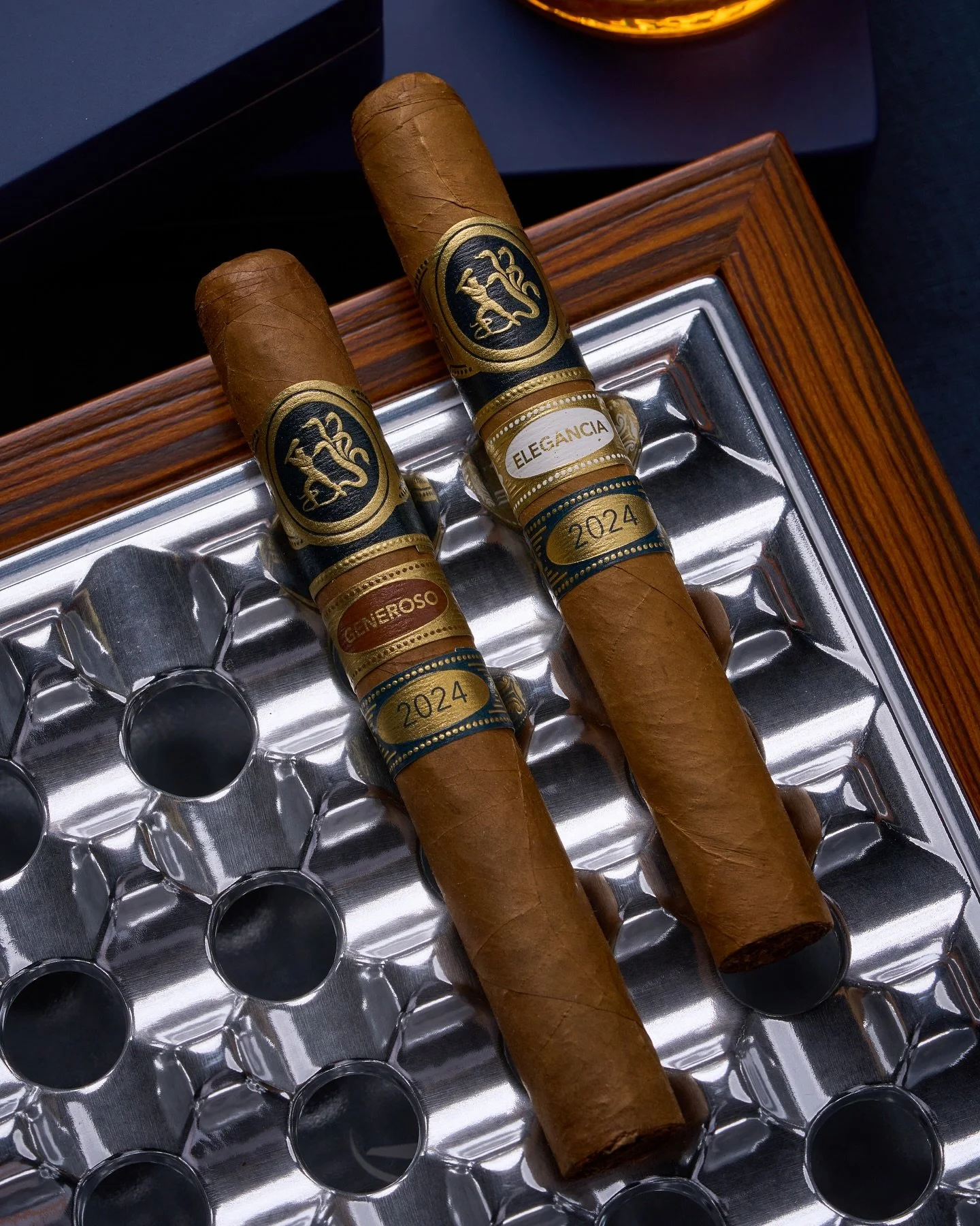 Ferio Tego’s fourth release of their flagship blends returns with the 2024 production of Elegancia and Generoso.  Both 6” x 50 toros, the two styles are offered in custom, hand-made humidors of ten cigars each.  The humidors are preloaded