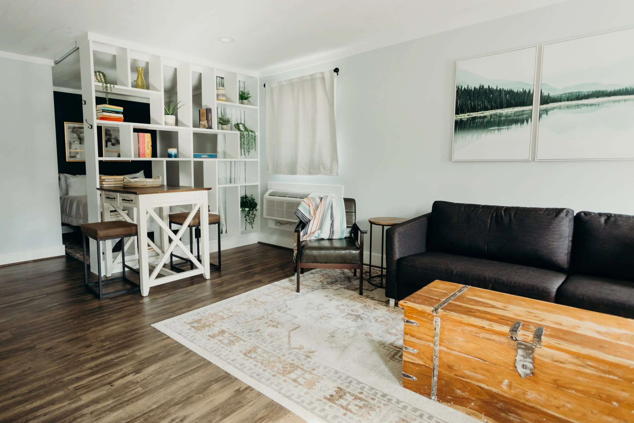 A chic, contemporary sofa featuring clean lines and modern design inside a revitalized guest suite at Lakeside Inn.