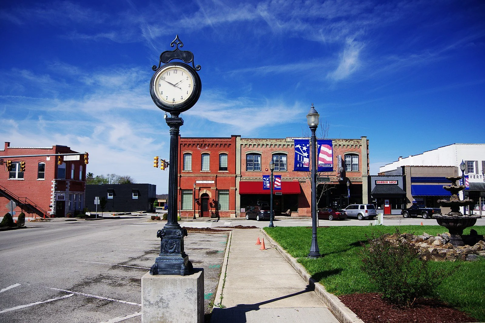 Historic town square and iconic street clock in downtown Livingston Tennessee featuring local storefronts and dining