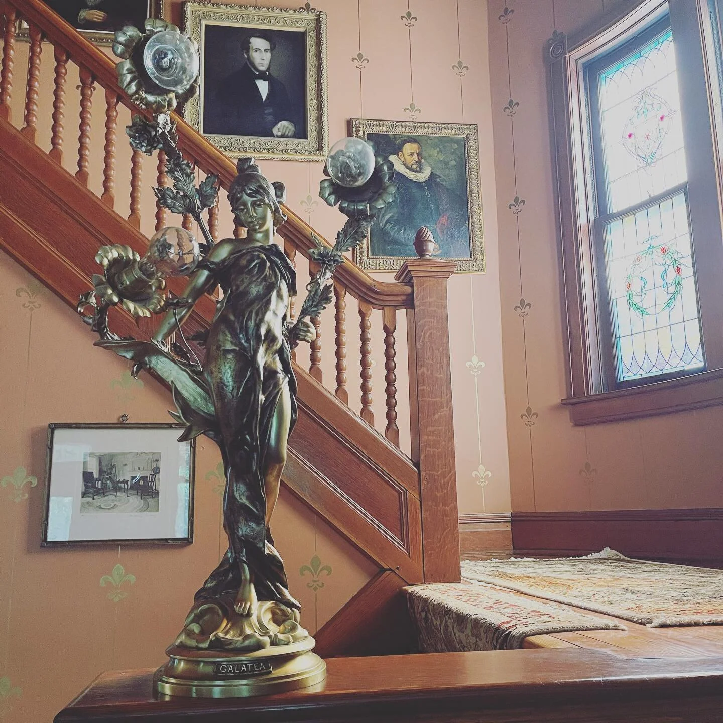 Opal and her bronzed lady, Galatea. These windows are the best in the afternoon and evening. We are still talking about redoing the walls and stencils in the entry and stairwell with brighter, more modern paint (white with gold stencils)