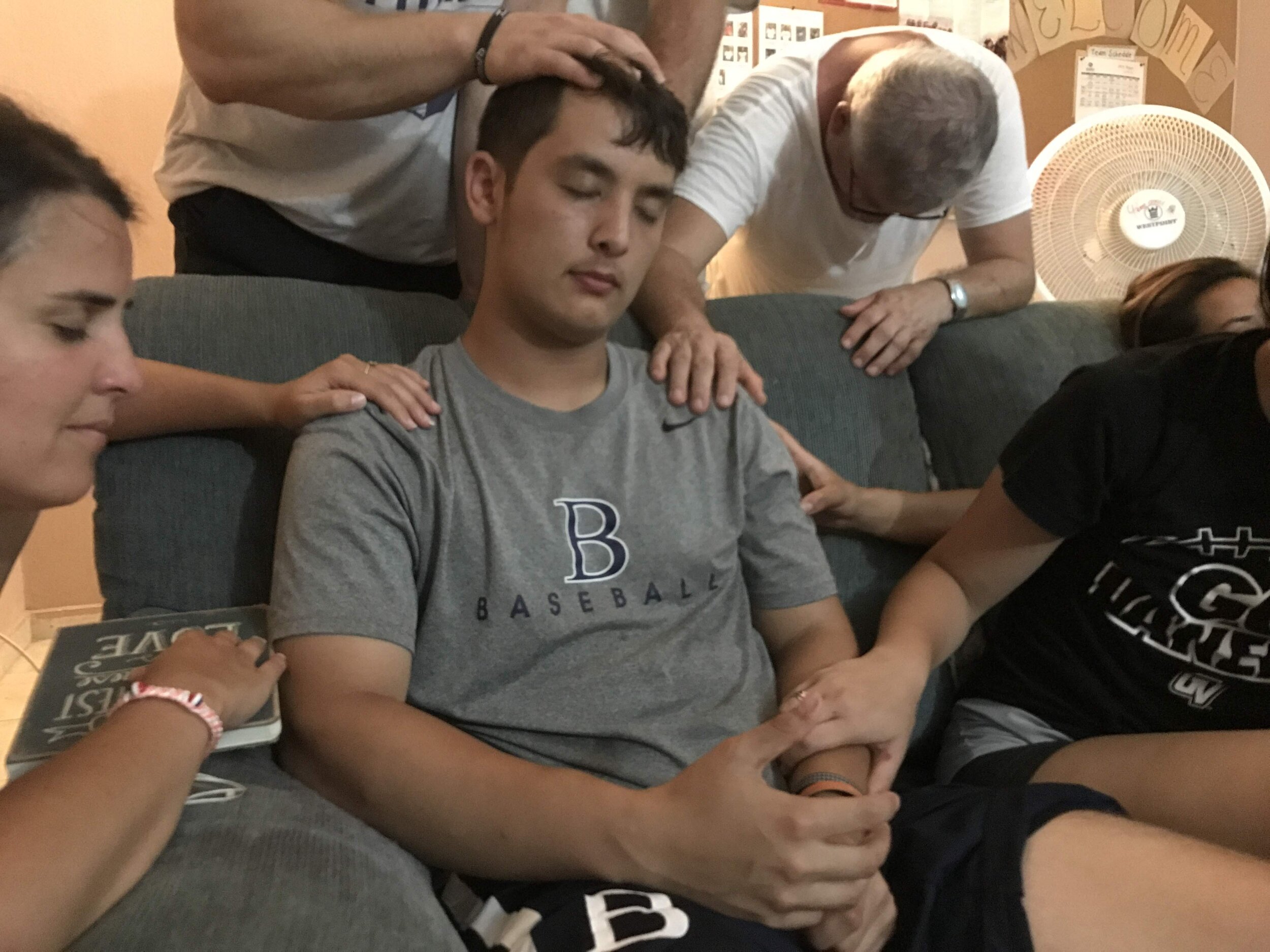 Praying over Patrick.jpg