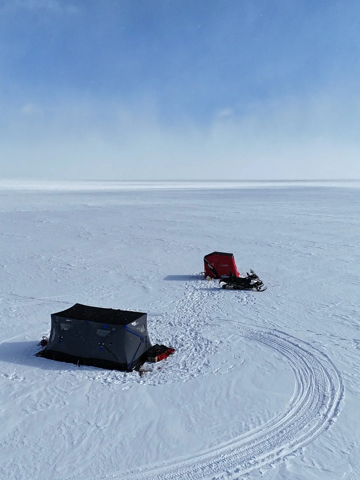 Otter hub hut and Eskimo 2600 hut on frozen Lake Simcoe