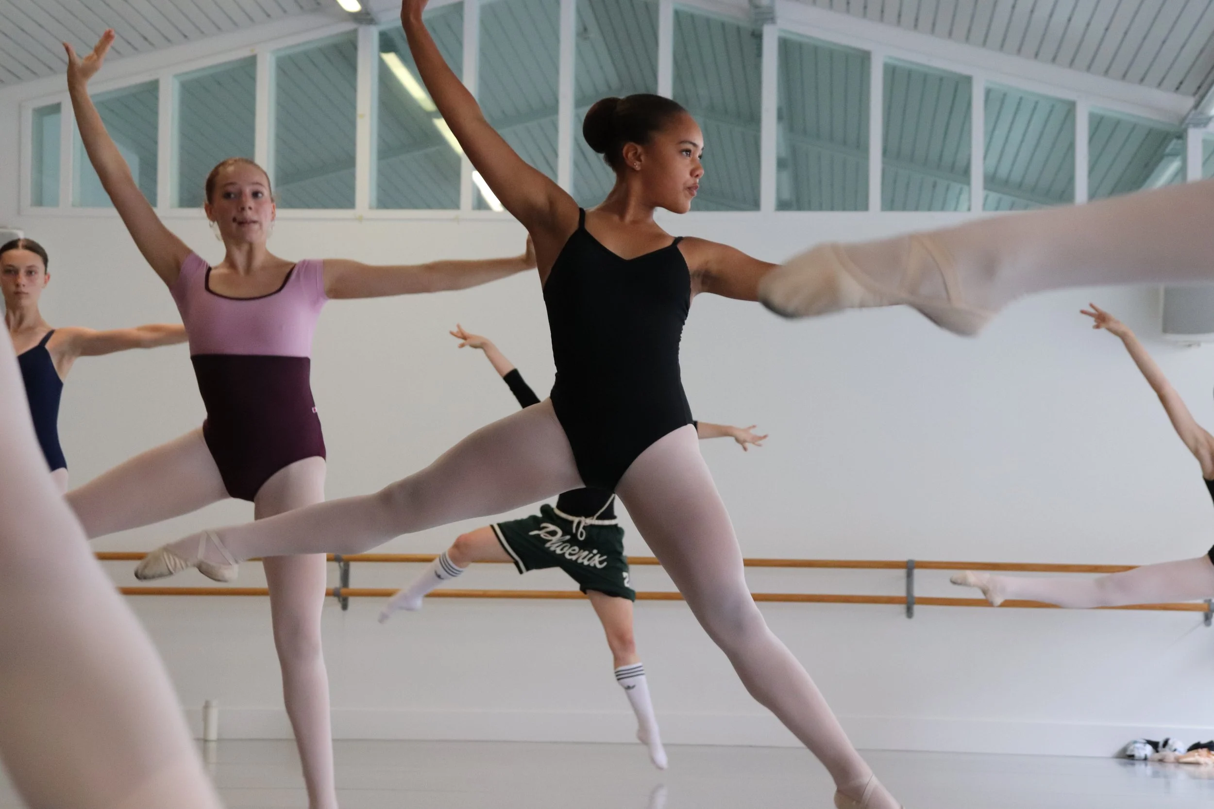 Loughlan Prior repertoire dancer performing a sissonne and looking to the right