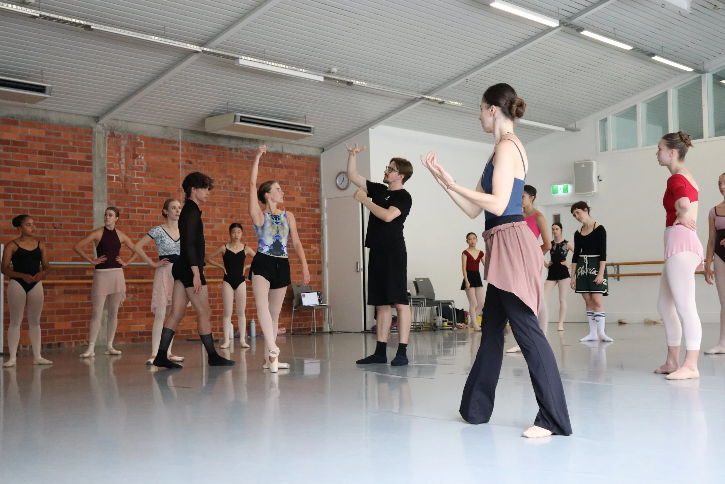 Loughland Prior describing pas de deux technique to attending workshop dancers