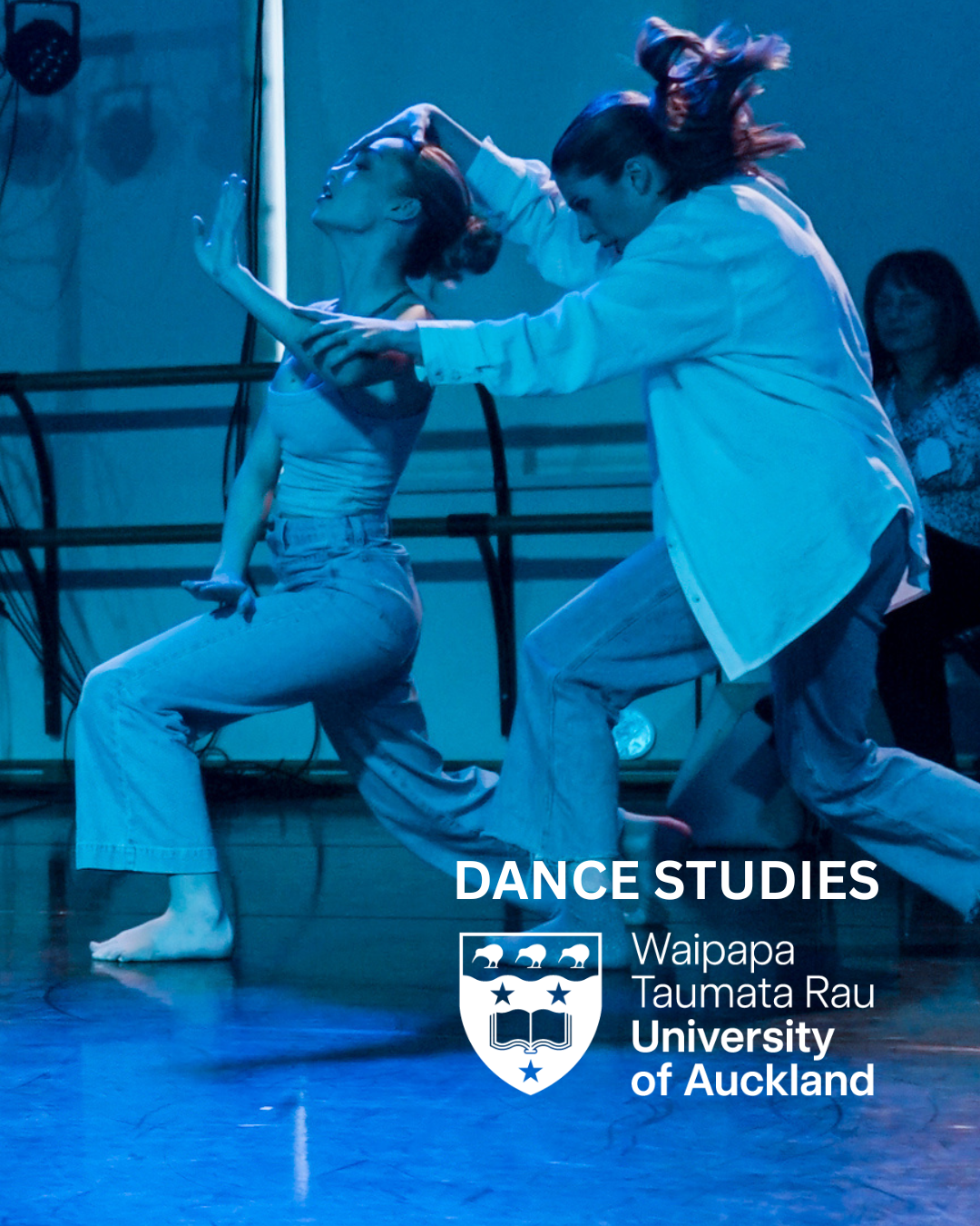 Auckland University Poster for Dance Studies. Image is blue and depicts two dancers in a lunge with one behind the other and dancer behind reaching forward to the head and shoulder of dancer in front. includes the University of Auckland logo