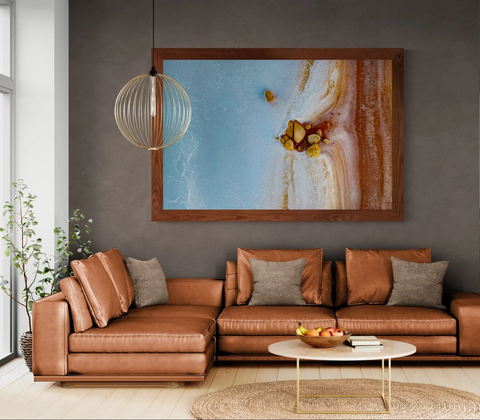 Living room with a leather sofa and plant wall.jpeg