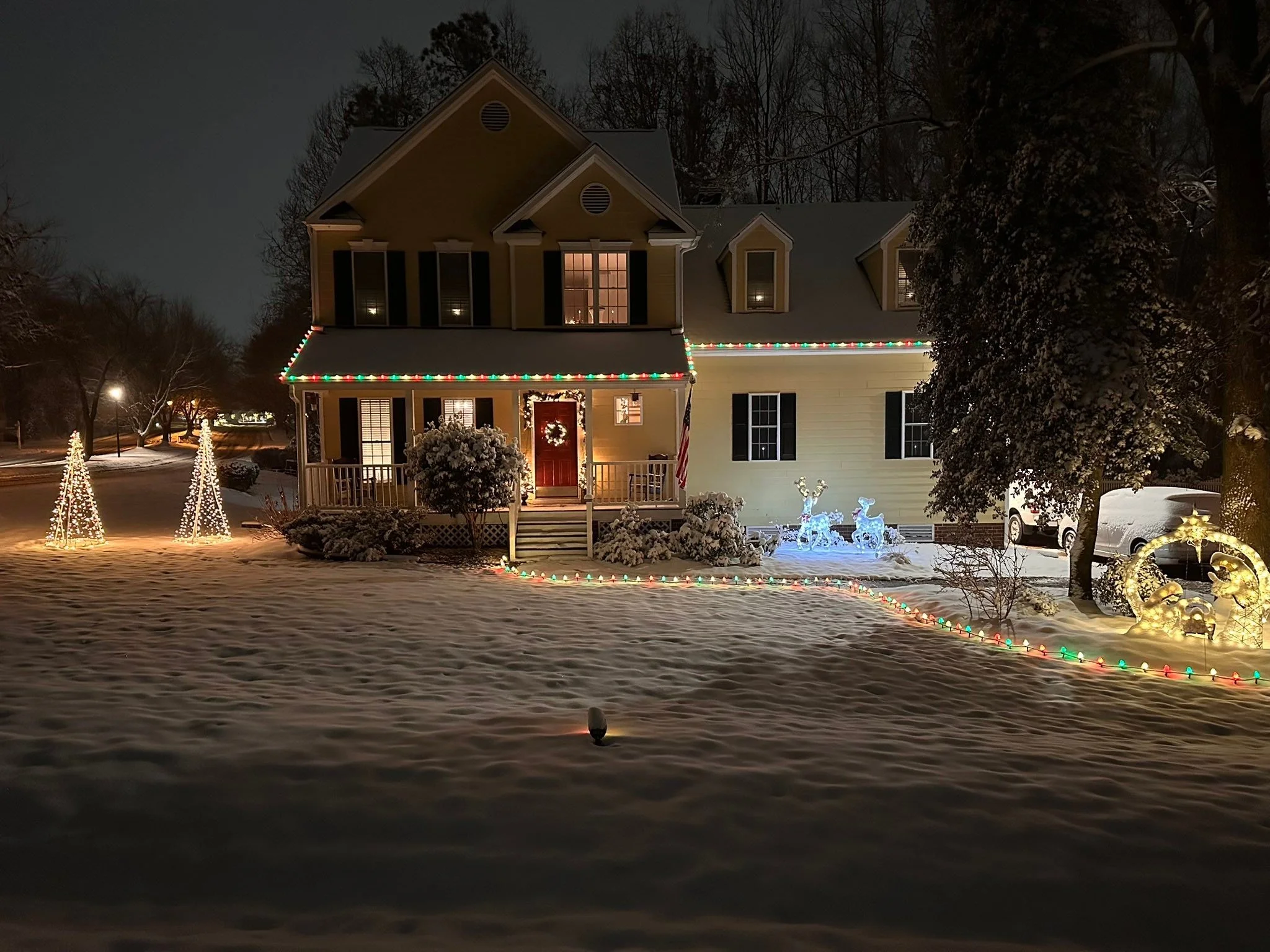 Pictures of the house at night with the snow.