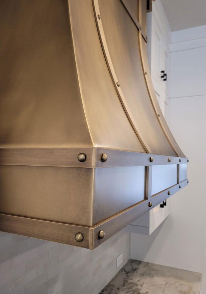 Curved - Hand Patinated Brass Vent Hood with Straps and Rivets - detail