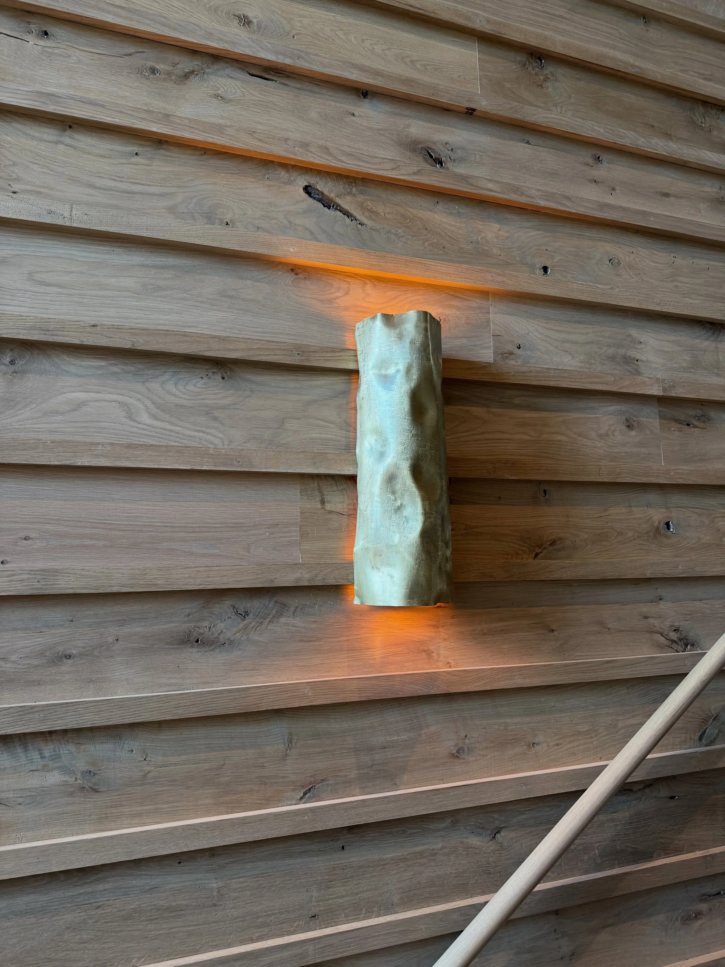 Lovely photos of our &ldquo;crushed&rdquo; sconces ! These are all brass that were formed / textured and crushed sheets . The internals are all machined brass and blackened steel as well . Also a magnificent stairway designed by @summerour_architects